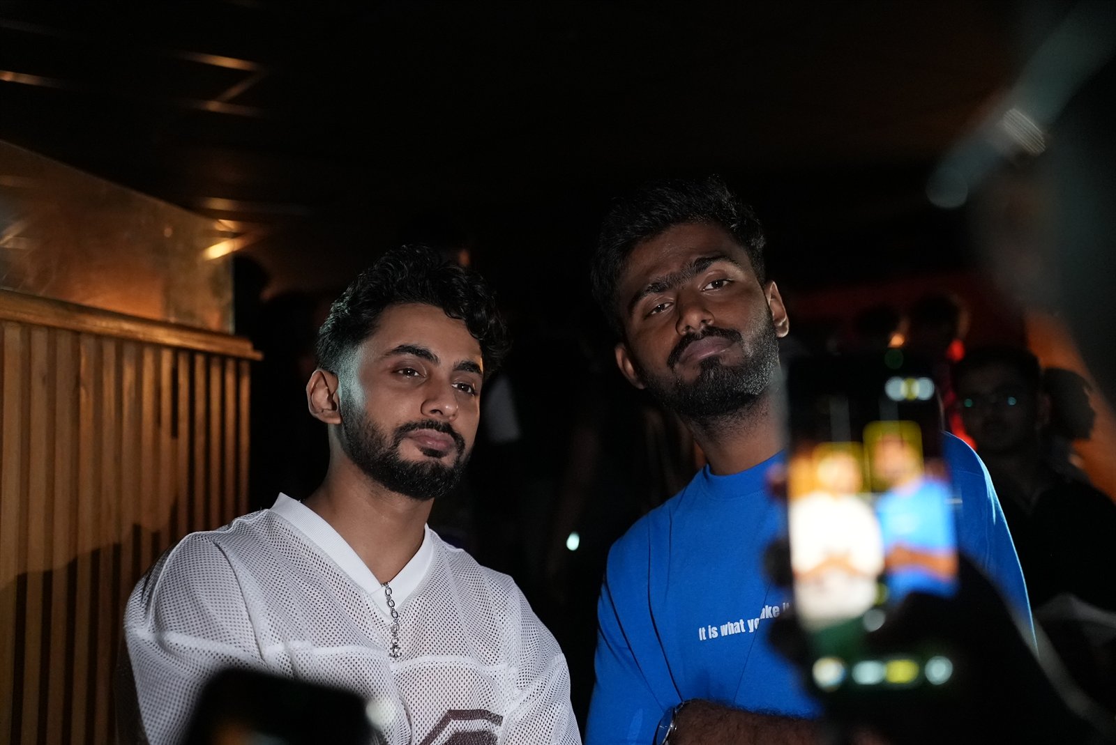 Two fans in low light