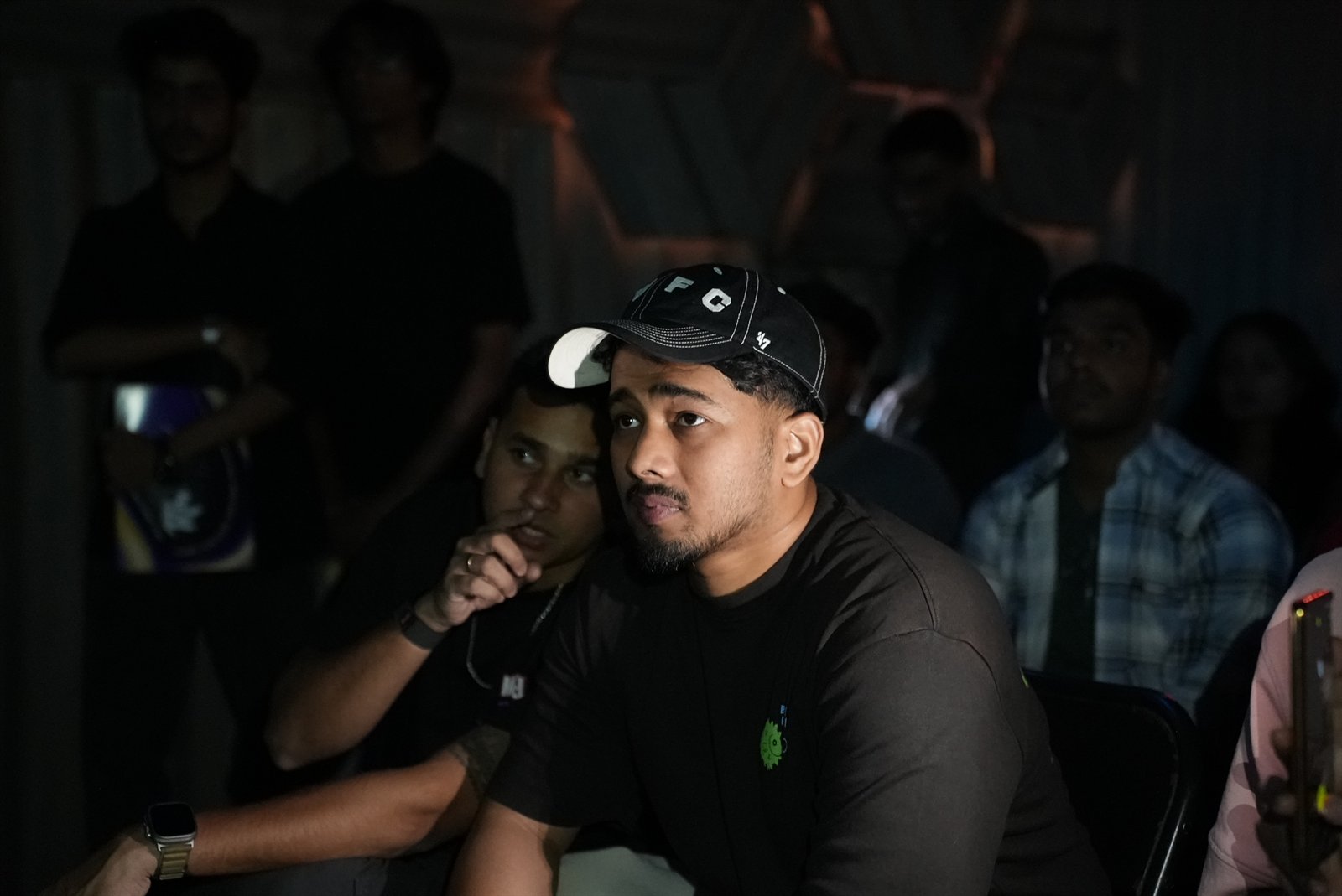 Audience member watching match