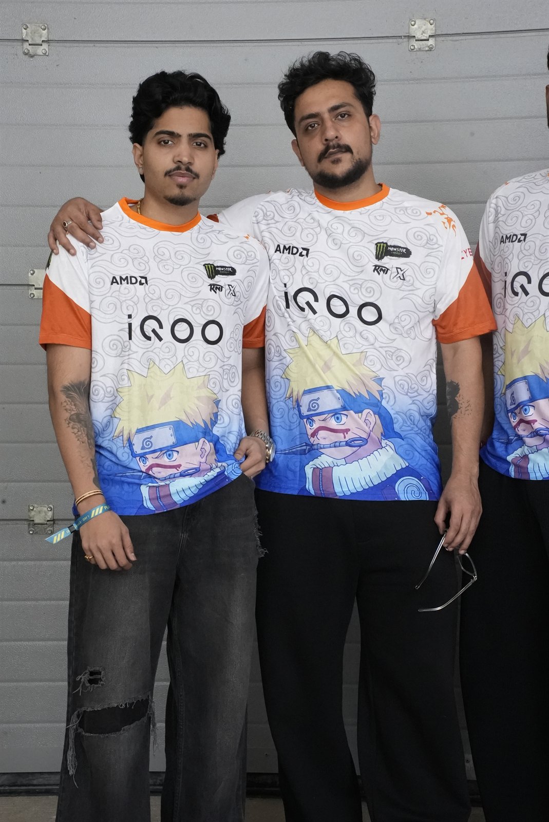 Two players showing team jerseys